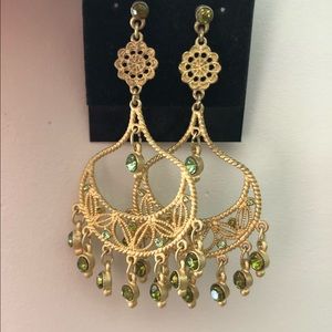 Gold earrings with green gemstones